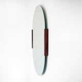 Round mirror with wooden frame on a white background
