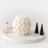 Salt & Pepper Terrazzo Dish With Woven Candle and Black Ring COnes